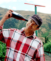 Sam Neill holding a bottle of wine